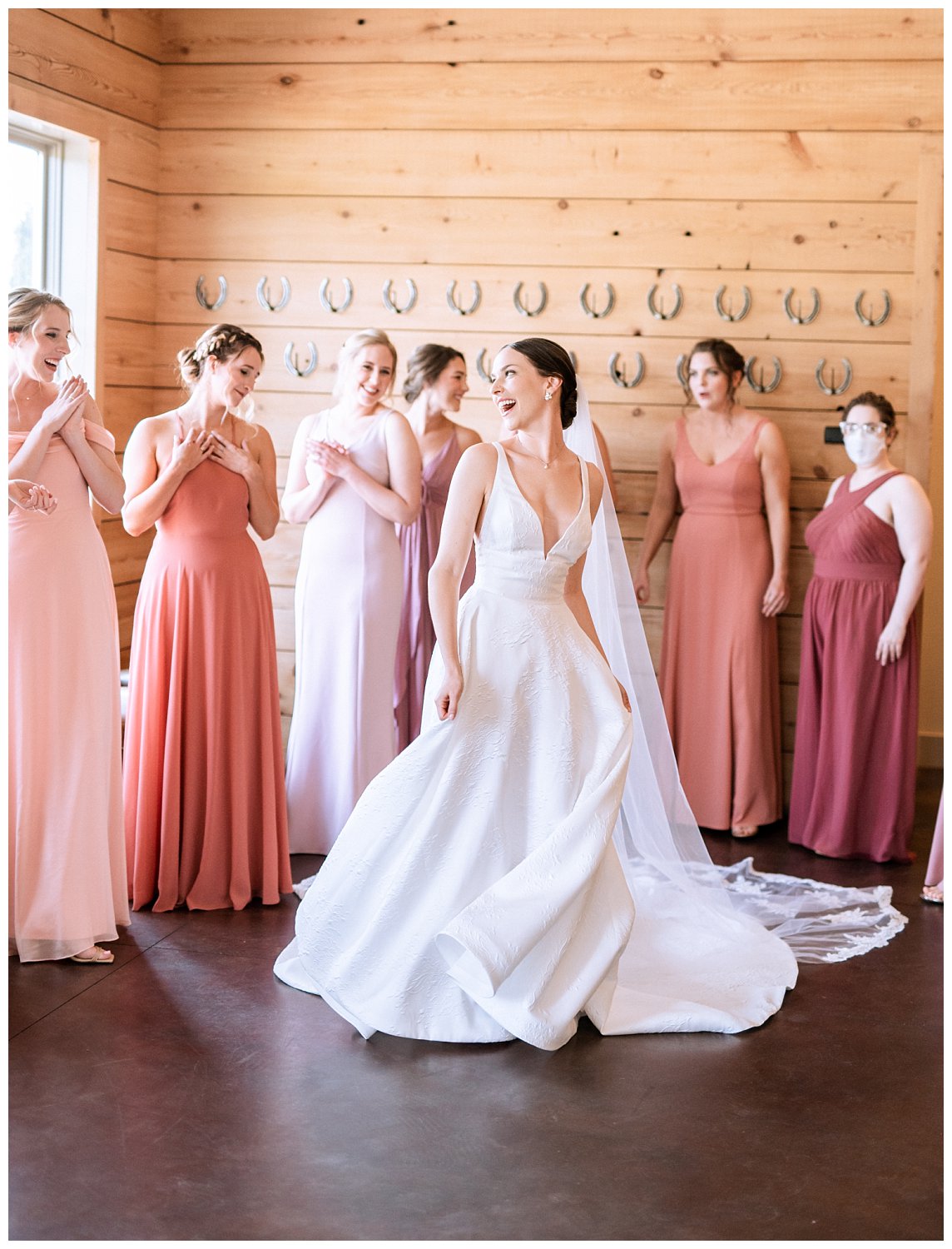 Bride reveal with bridesmaids in mismatching pink dresses